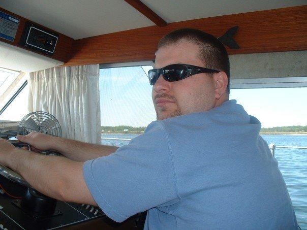 don wearing sunglasses on the boat